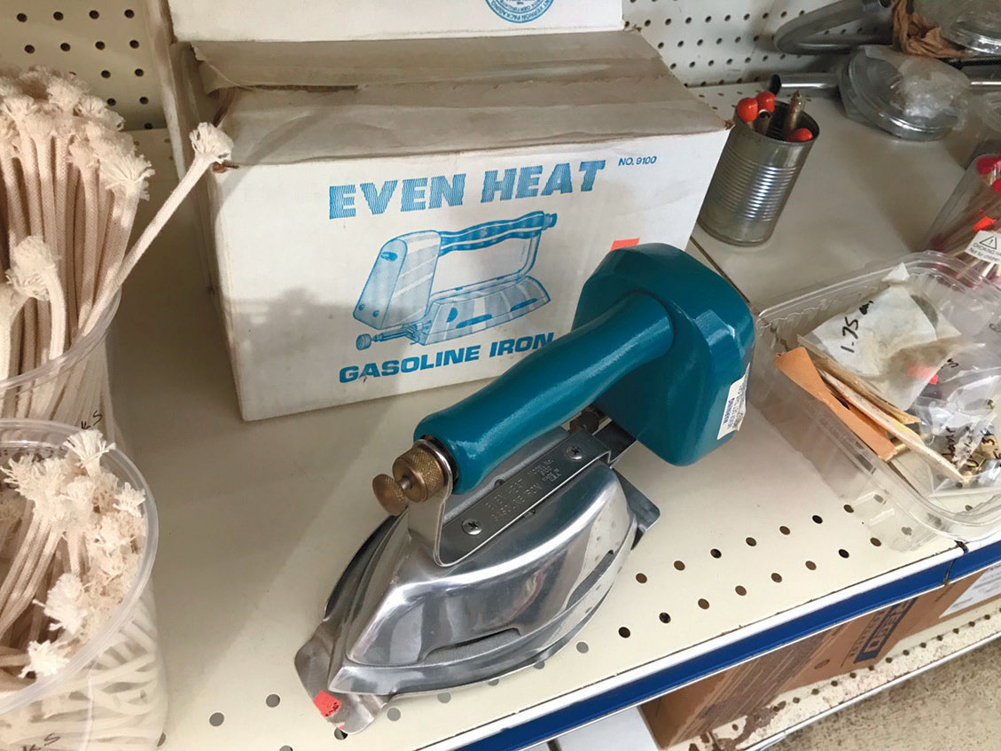 The store's product line reflects the community's reliance on gas such as a gas iron.
