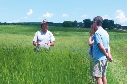 David Meuer out in his field with visitors. Contributed photo