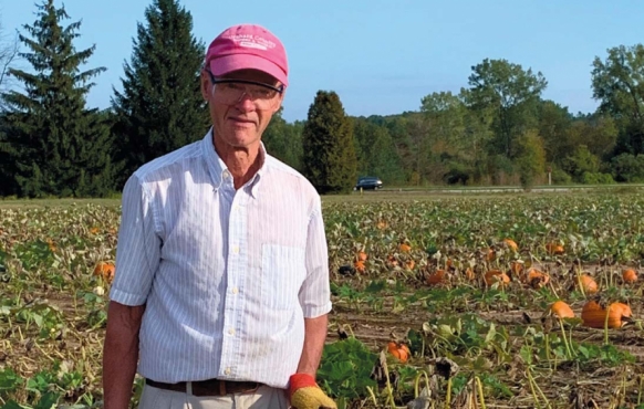 Ken Chaudoir with some of his specialty pumpkins. Photo by Sue Anschutz